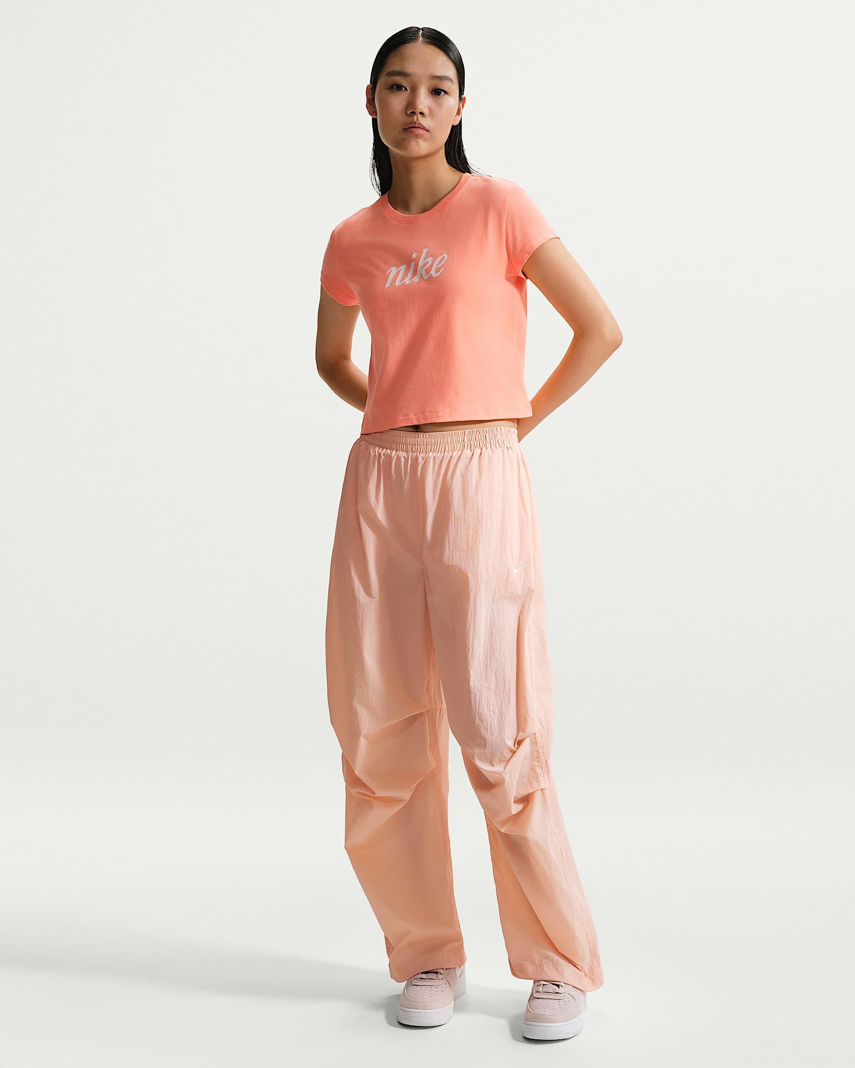 Nike Sportswear 女子防晒拒水中腰轻盈长裤 - 橙粉/帆白