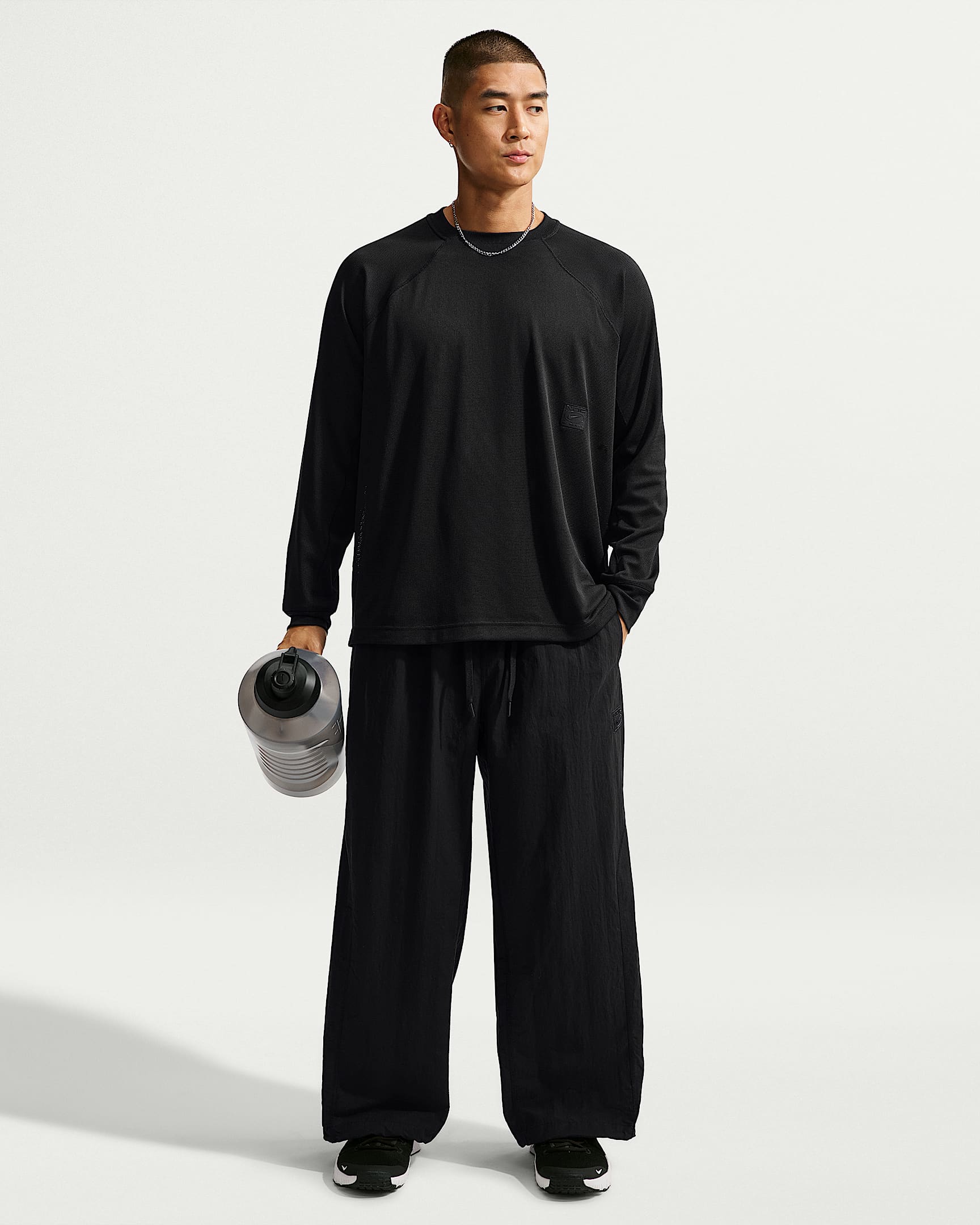 Nike N.A.C. Dri-FIT 男子 Oversize 风速干梭织长裤 - 黑/黑