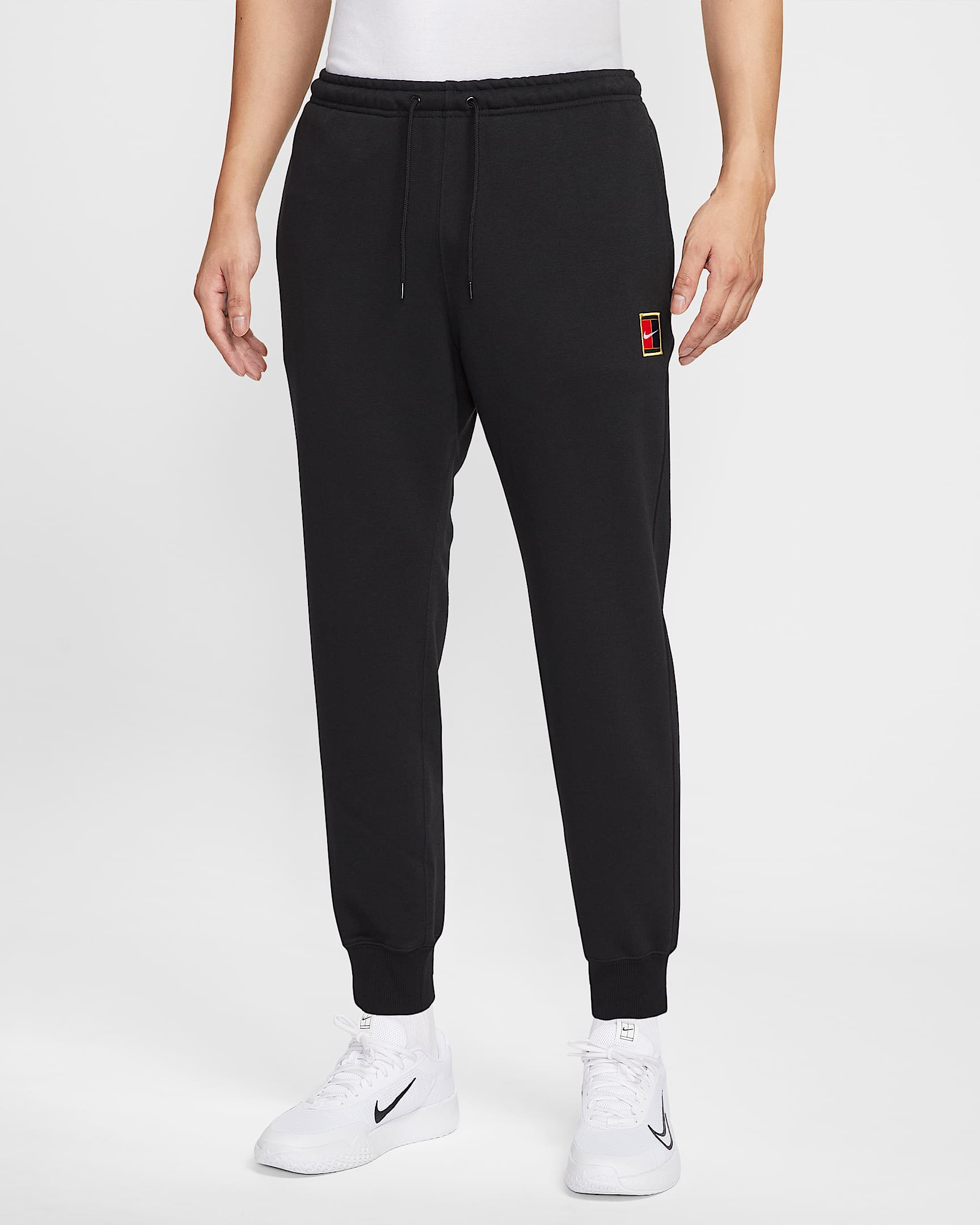 NikeCourt Heritage Dri-FIT 男子速干针织网球长裤 - 黑
