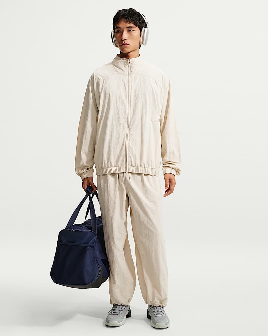 Nike N.A.C. Dri-FIT 男子 Oversize 风速干梭织长裤 - 浅土褐/浅土褐