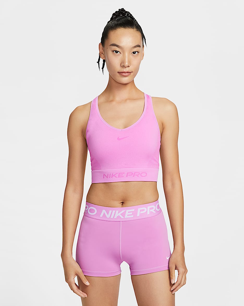 Nike Pro Dri-FIT 女子平整缝线速干紧身塑形训练短款背心 - 浅品红