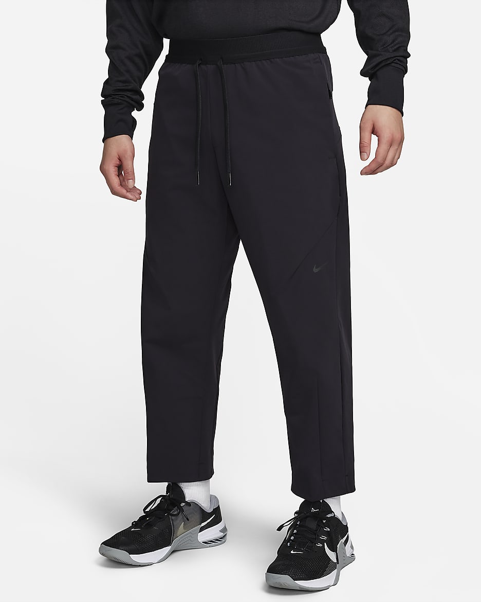 Nike A.P.S. Dri-FIT 男子速干梭织百搭长裤 - 黑/煤黑