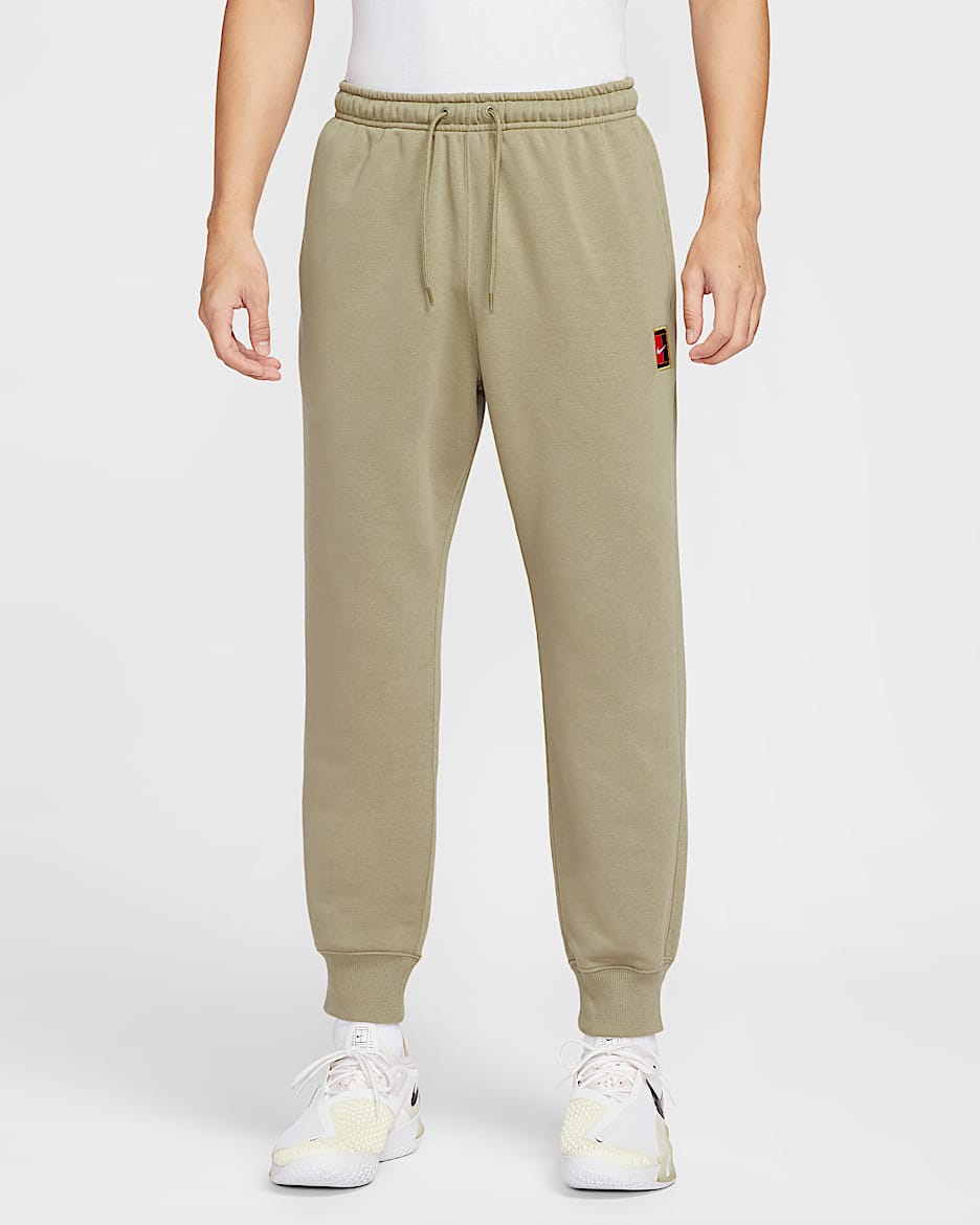 NikeCourt Heritage Dri-FIT 男子速干针织网球长裤 - 橄榄绿