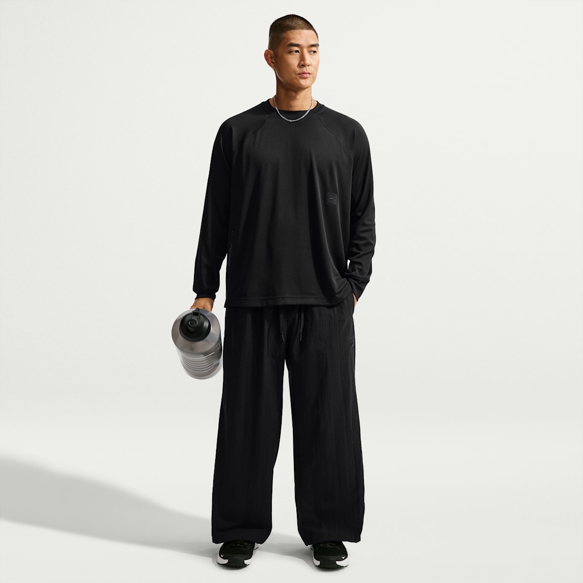Nike N.A.C. Dri-FIT 男子 Oversize 风速干梭织长裤